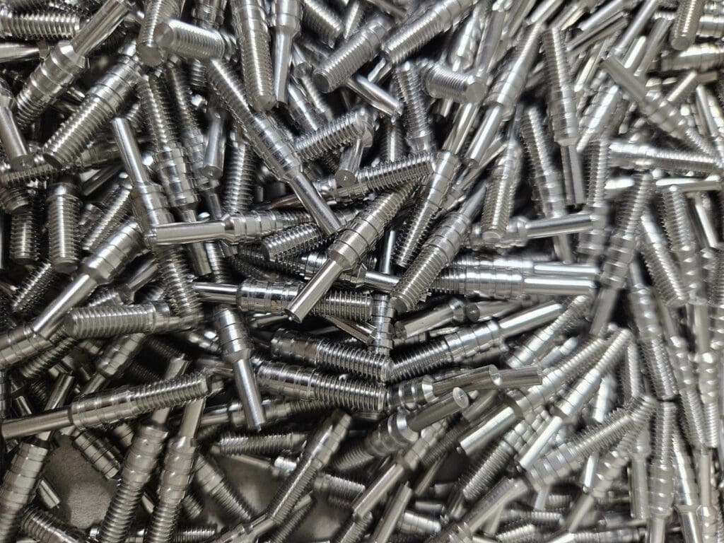 Machine meatal studs with threads